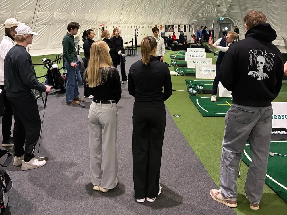 A Green Card course group in a circle around the instructor