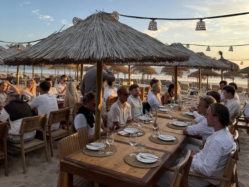 Dinner on the beach at sunset on the golf trip
